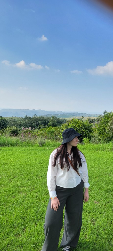 Person in a green field wearing Recchi Studio